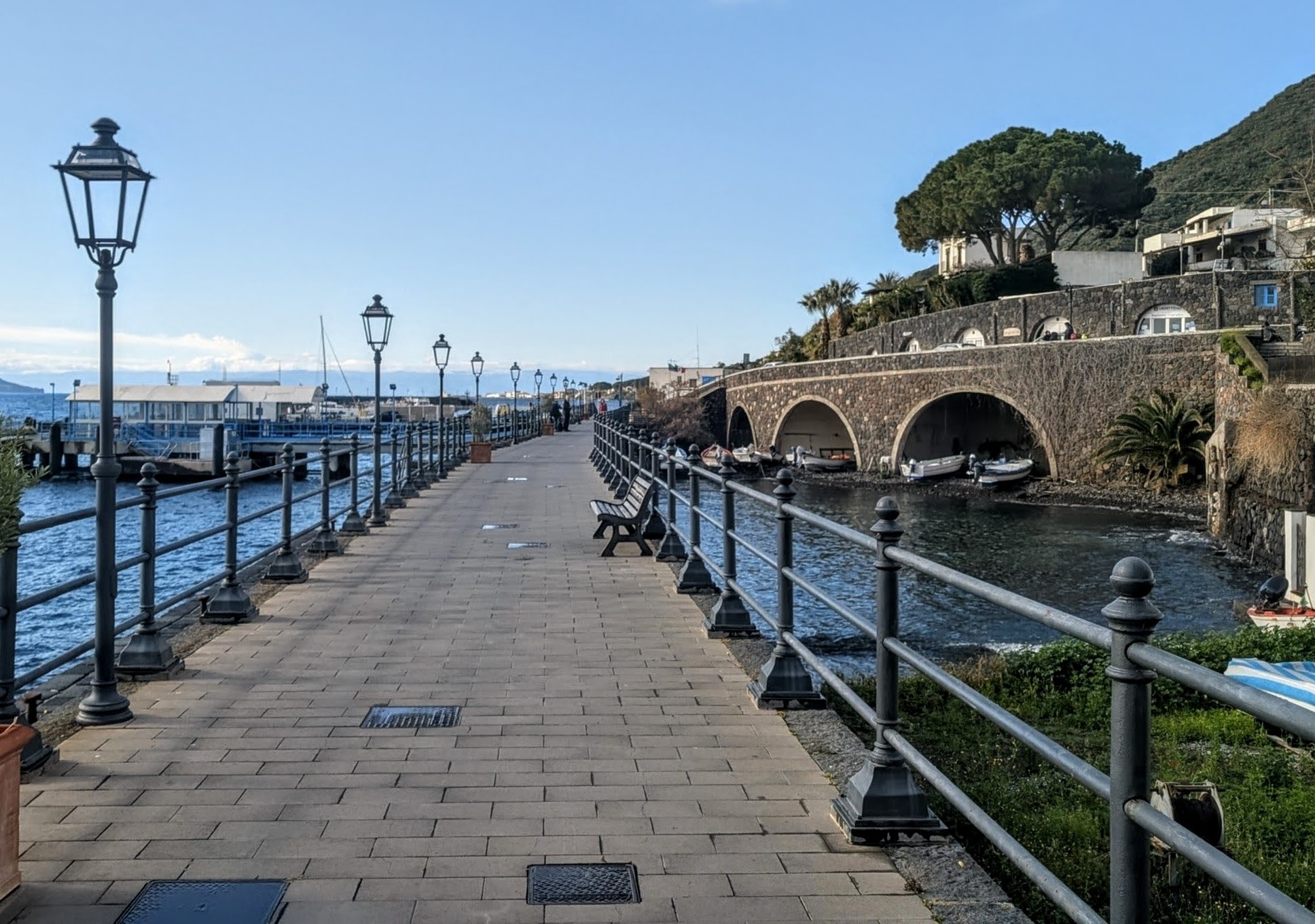 A pedestrian promenade in the harbor of Santa Marina di Salina.