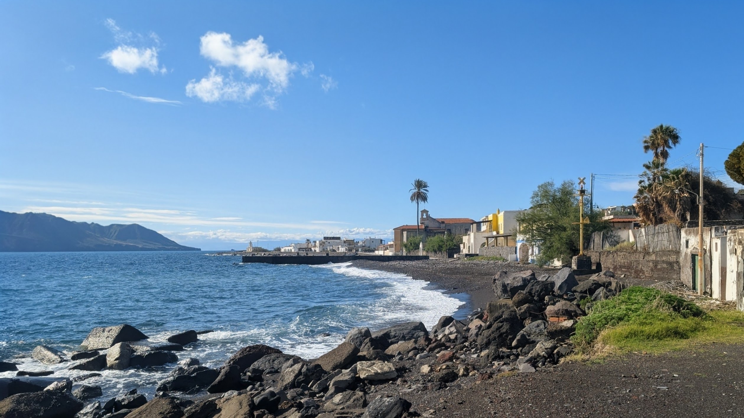 Black volcanic pebble beach at Lingua, the village on Salina island.