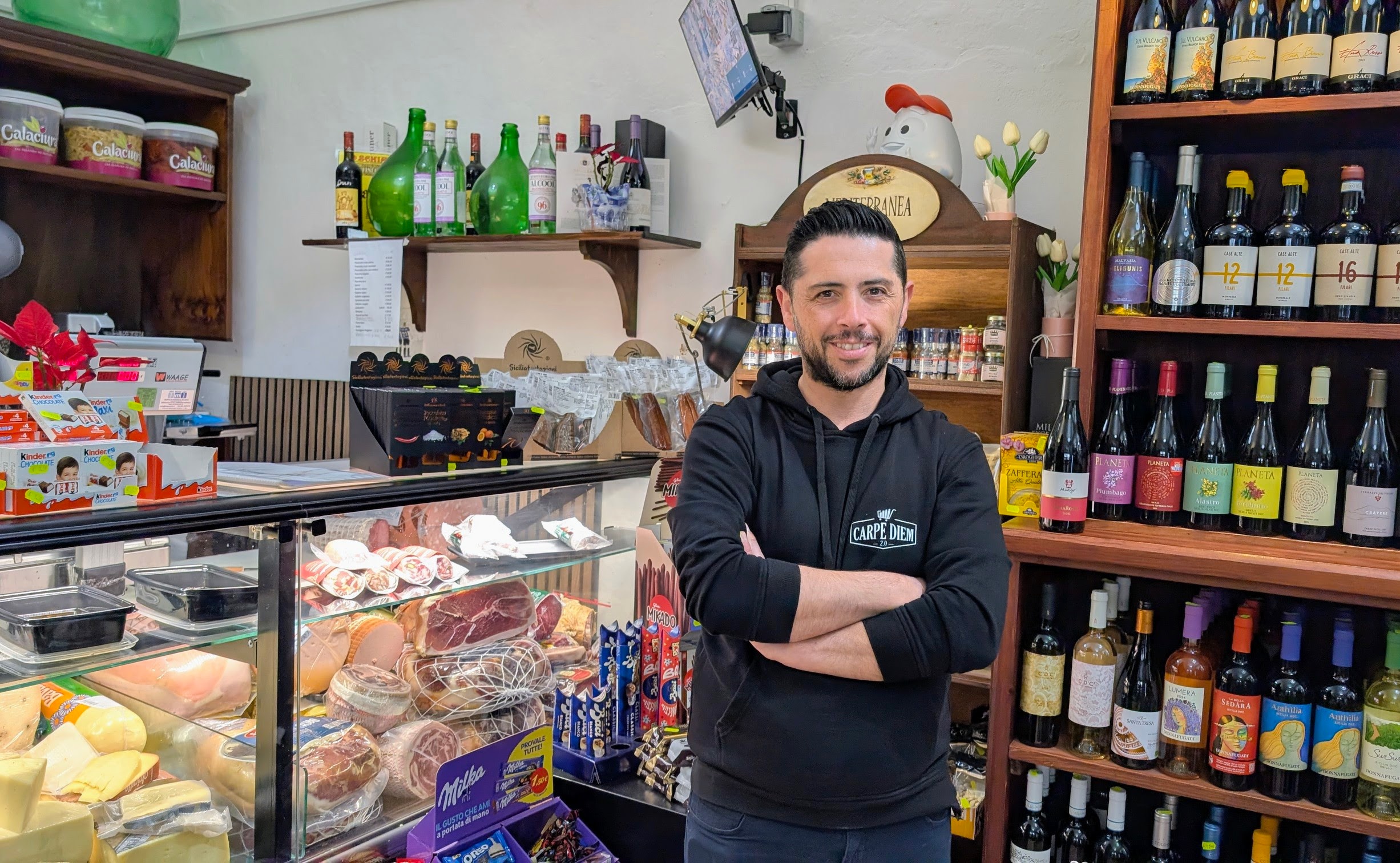 Maurizio, the owner of Carpe Diem, the boutique grocery store and a deli in Santa Marina di Salina. 
