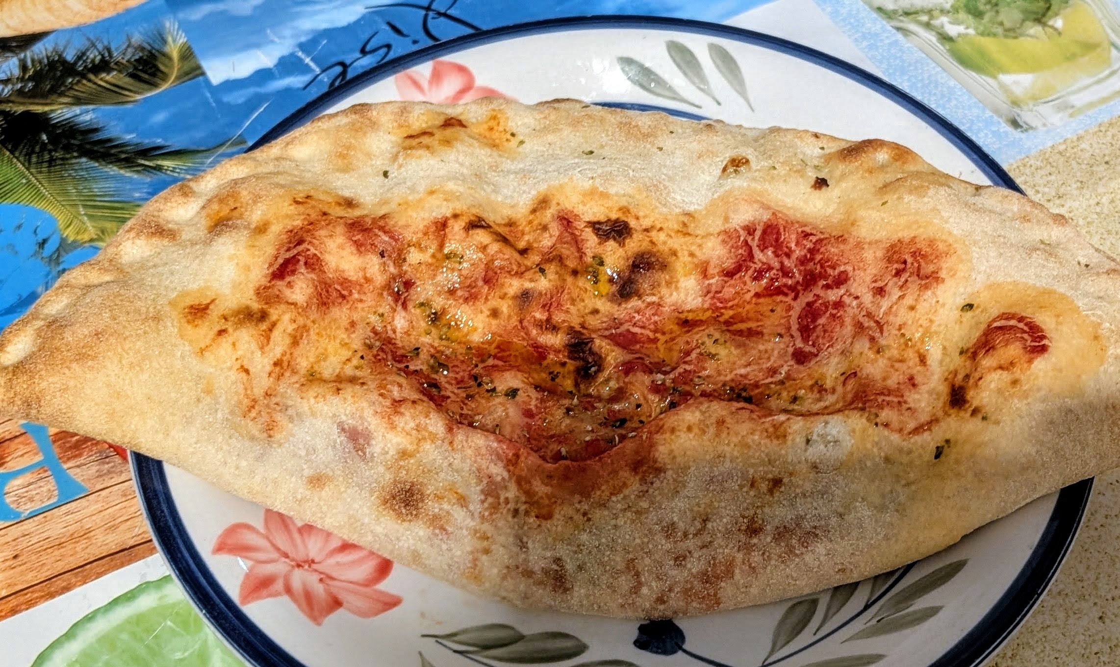 Filled with ham, cheese and mushrooms, calzone from the Pizzeria and Bar Bagghiu Lisciu.