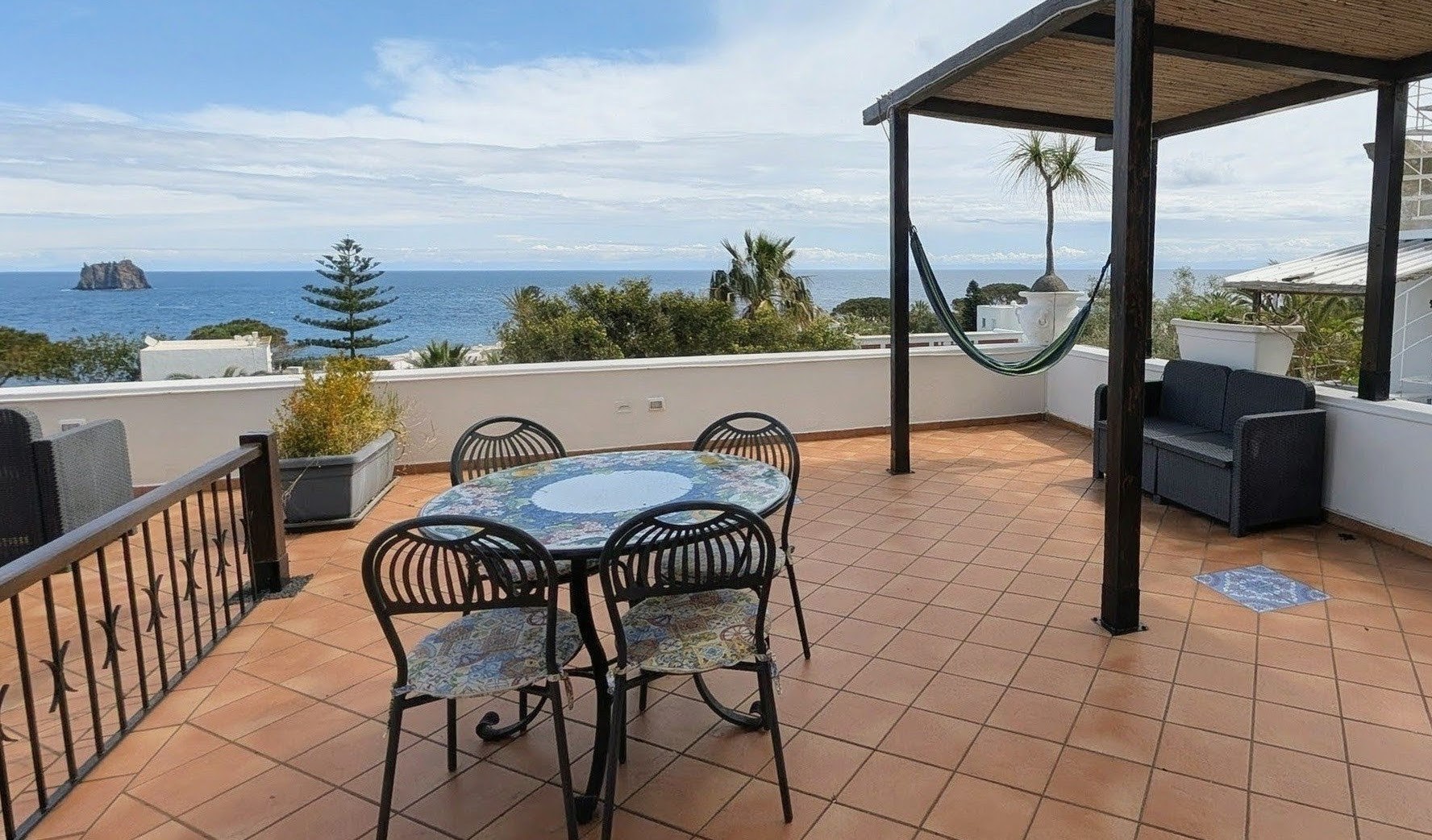 Open-air terrace on the second floor of Pedra Residence, an excellent guesthouse on volcanic island of Stromboli.