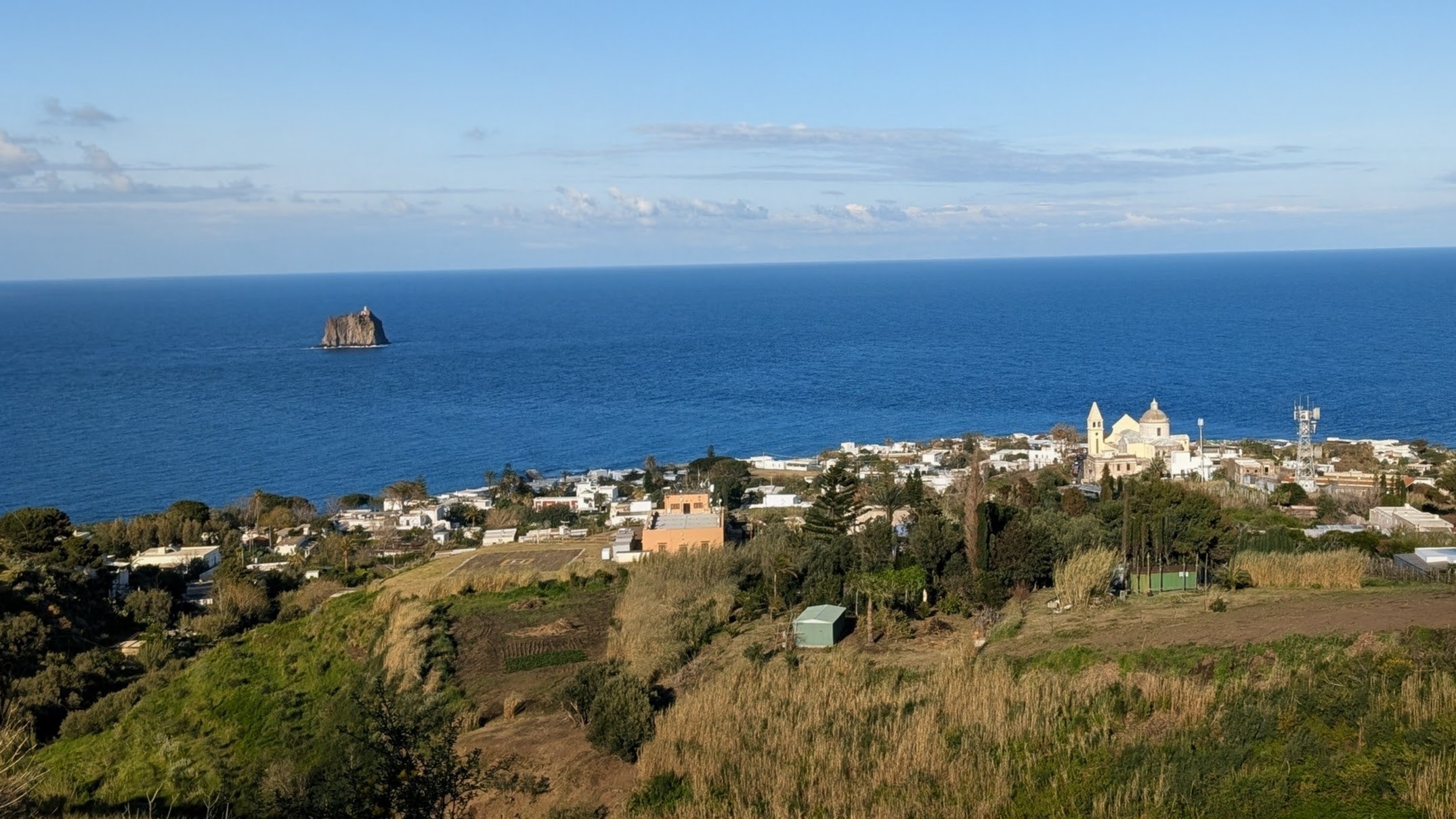 The view on San Vincenzo from the trail to the crater of active volcano on Salina island.